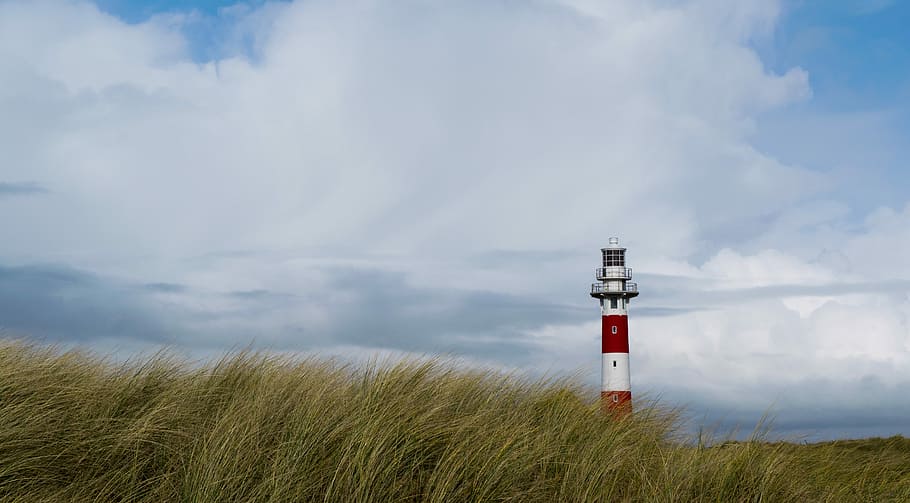 Lighthouse, grass field with lighthouse, cloud, sky, cloudscape HD wallpaper