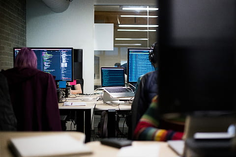At Work, two person in front of computer inside lighted room HD wallpaper