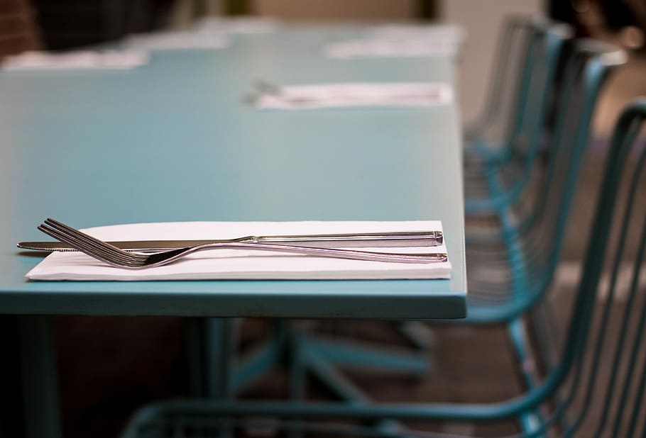 silver fork beside knife on green table selective focus photography, stainless steel fork on tissue paper HD wallpaper