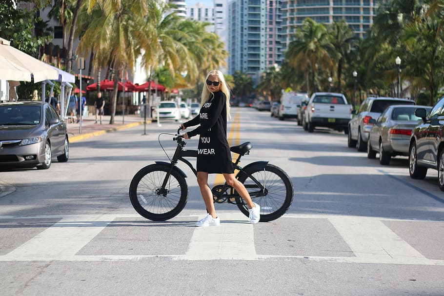 Woman In Black Long Sleeve Shirt Holding Bicycle, bike, blonde