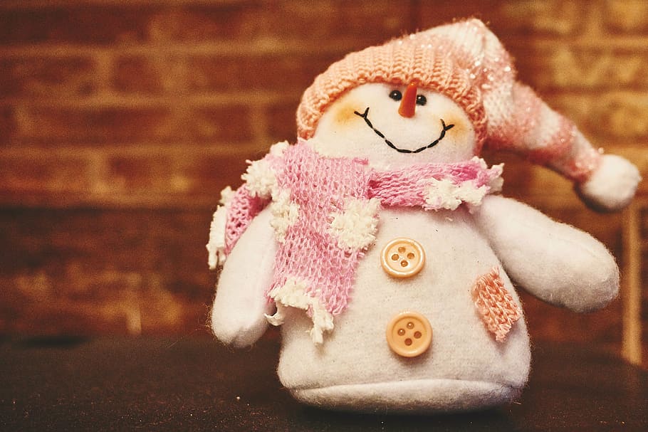 snowman plush toy on black cloth, white, beige, pink, scarf HD wallpaper