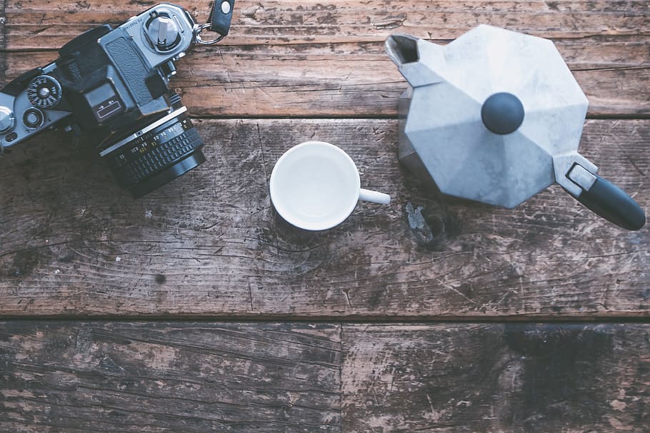 black DSLR camera near pitcher and mocha pot on wooden surface HD wallpaper