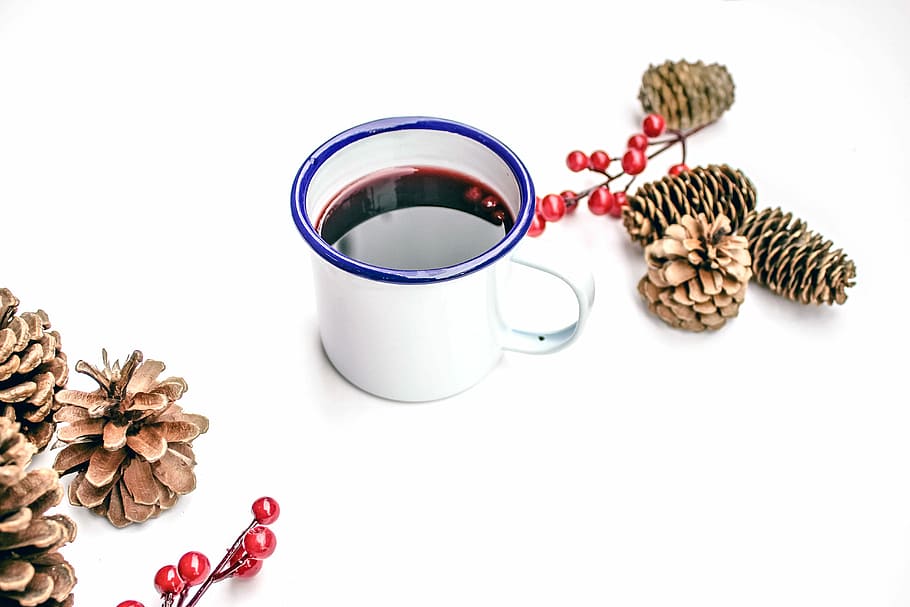 black liquid on white mug beside pine cones, black liquid filled white ceramic mug HD wallpaper