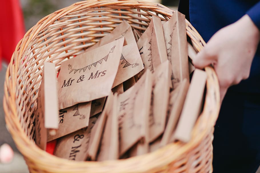 person holding Mr & Mrs enveloped lot, person holding basket of letter HD wallpaper