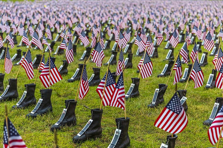 USA flag in black boots lot, US Soldier's cemetery, memorial