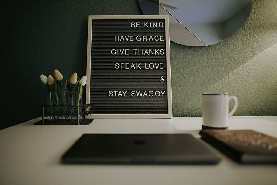 rectangular brown quote board, chalkboard leaning against wall near mug and laptop, HD wallpaper