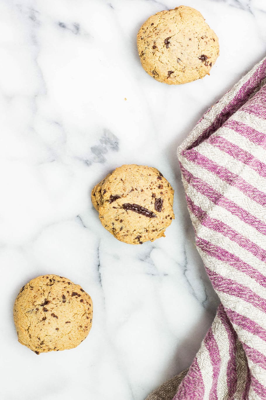 three round chocolate cookies on white surface, three brown cookies HD wallpaper