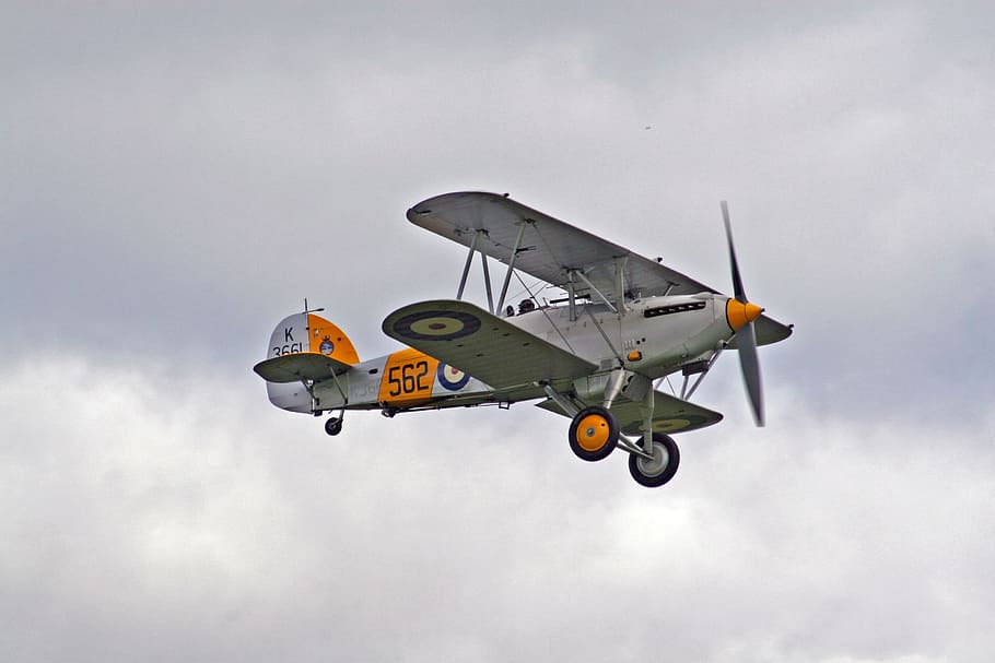 white and orange bi-plane in mid air, white and orange biplane in flight HD wallpaper