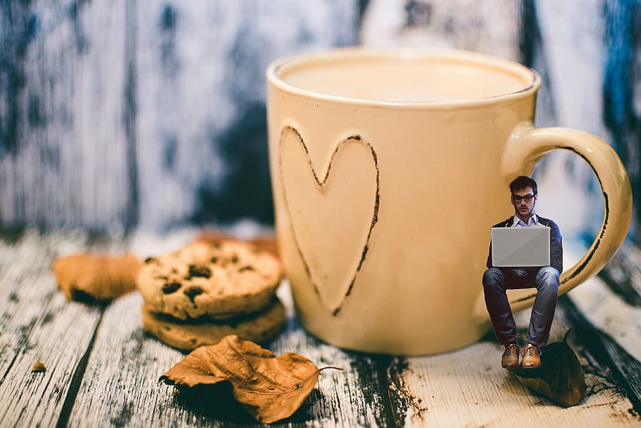 man sitting on brown mug handle photo, coffee, cookies, breakfast HD wallpaper