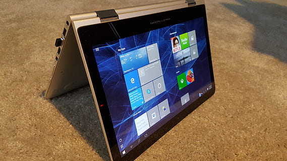 black and gray Microsoft Windows Surface turned on on brown surface HD wallpaper
