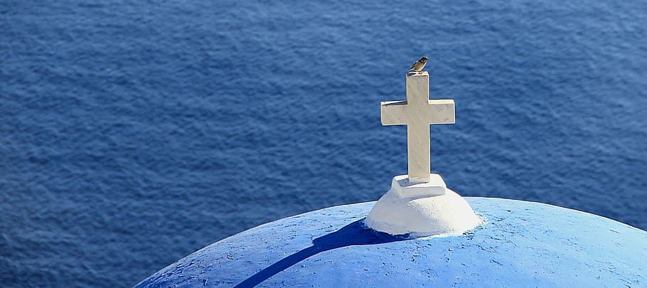 bird perched on white concrete cross, greece, sea, church, spiritual