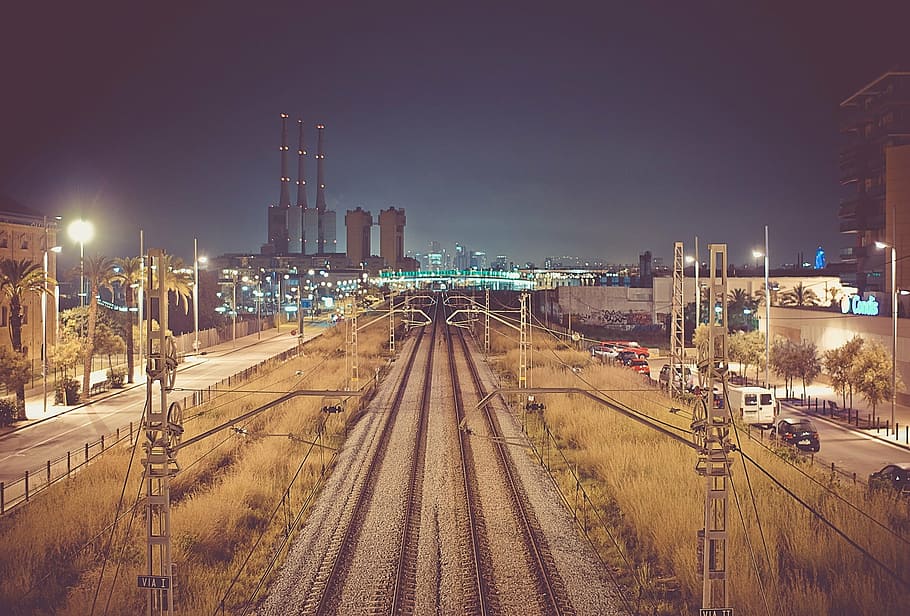 train rail between electric post at nighttime photo, rails HD wallpaper