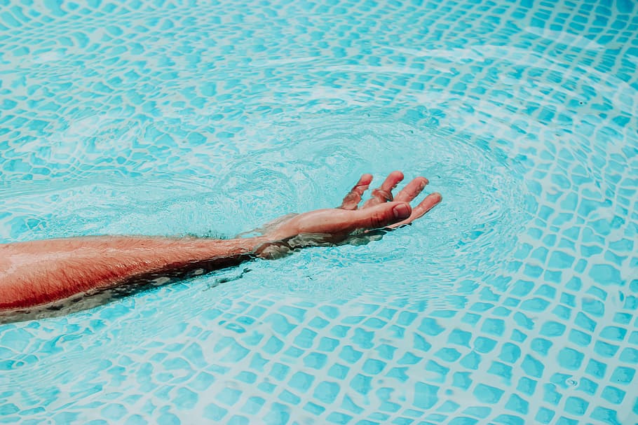 person's hand on above body of water during daytime, person's hand on water HD wallpaper