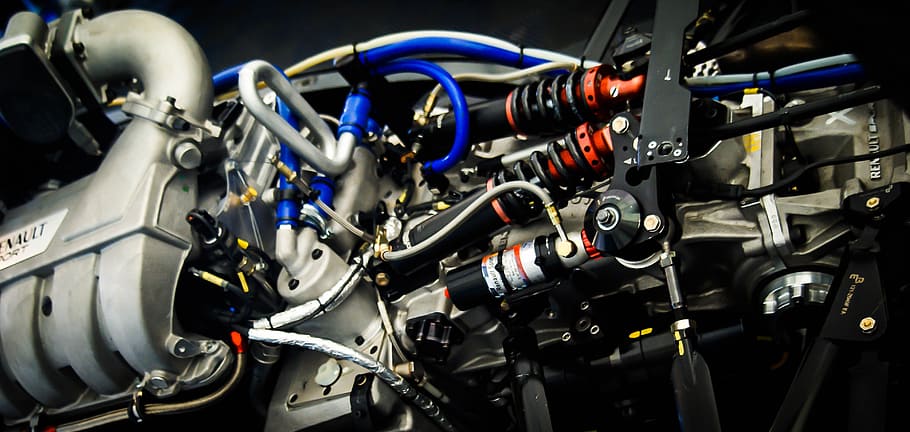 photography of gray and black vehicle engine, racing car engine