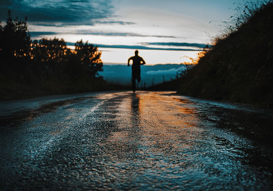 silhouette photo of a person running on road, silhouette on person running on road HD wallpaper