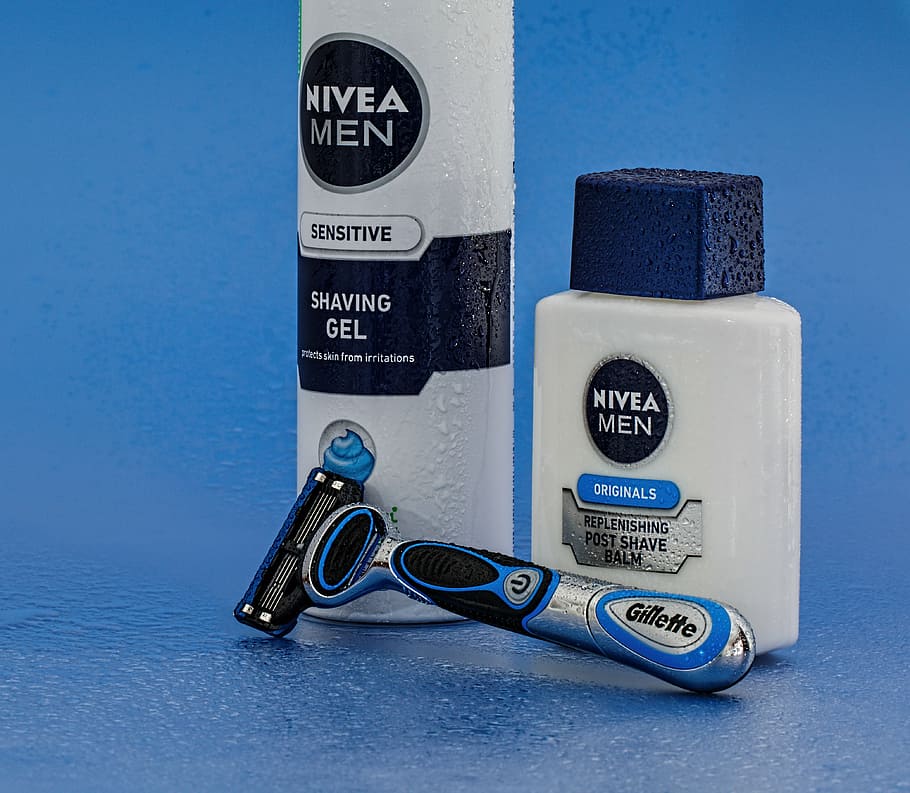 two Nivea Men shaving gel bottles, razor, shaving cream, aftershave
