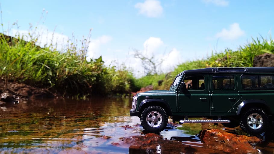 green die-cast SUV toy beside green grasses, photography, creative HD wallpaper