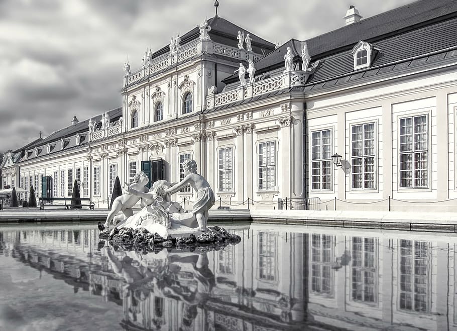 two toddlers concrete statue on water fountain near building grayscale photography HD wallpaper
