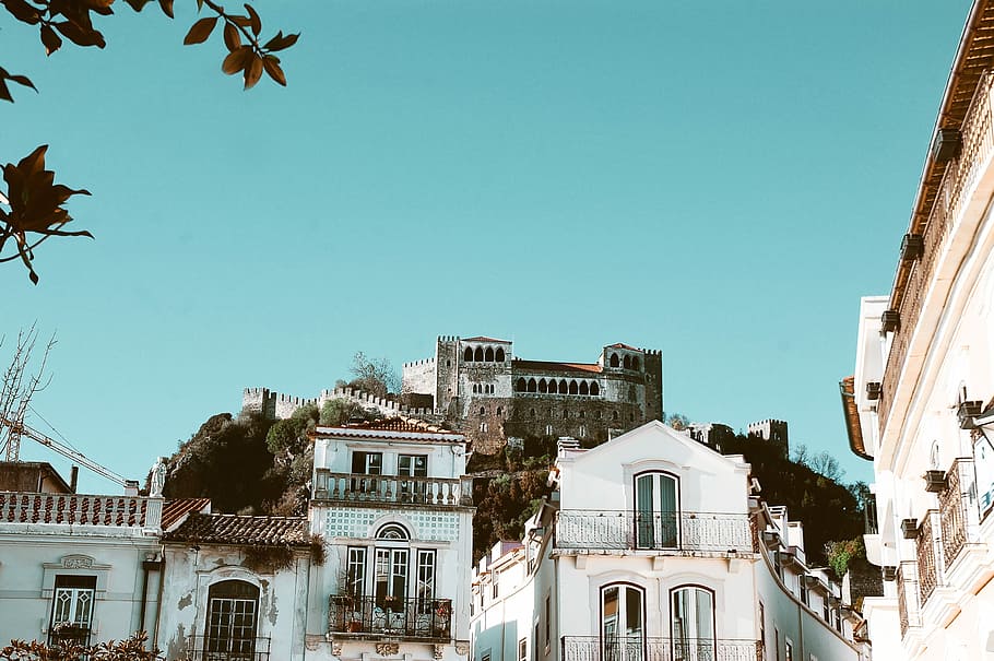 photo of high-rise concrete buildings, low-angle photo of gray concrete castle during daytime HD wallpaper