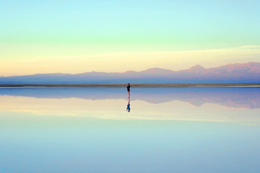 woman standing on body of water at daytime, black, shirt, near HD wallpaper