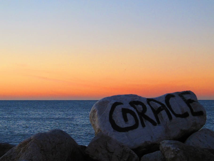 stone, sea, sunset, sky, rock, water, horizon, text, horizon over water HD wallpaper