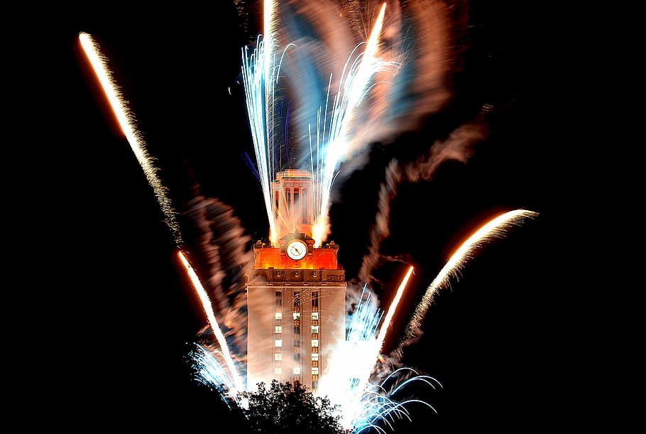 brown and orange clock tower in time lapse photography, timelapse photography of fireworks near brown tower at nighttime HD wallpaper