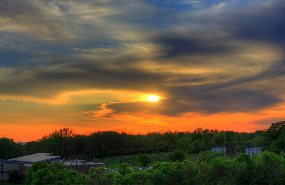 Orange sunset behind clouds in the distance in Southern Wisconsin HD wallpaper