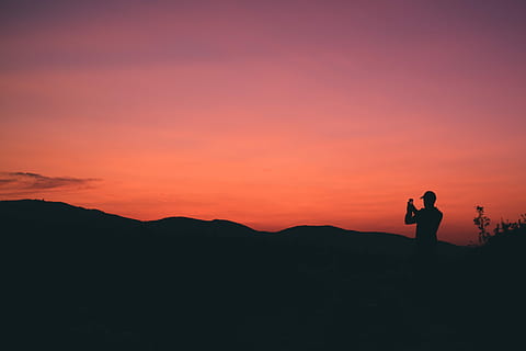 silhouette of person taking photo of mountain during sunset, silhouette of man during golden hour HD wallpaper