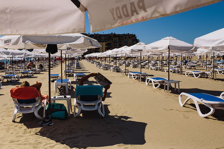 Umbrellas and lounge chairs on Sunny Beach, Bulgaria, ocean, sand