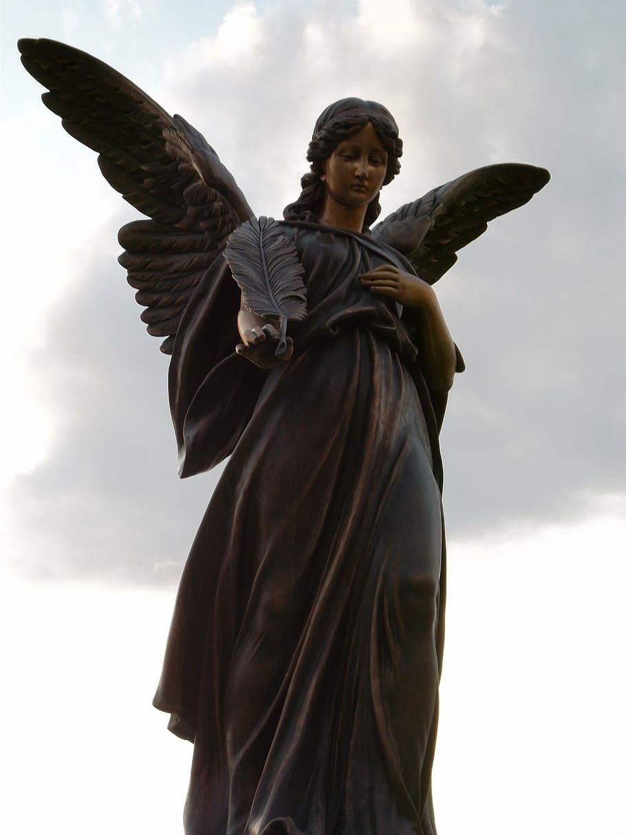 black female angel statue under cloudy sky during daytime, sculpture