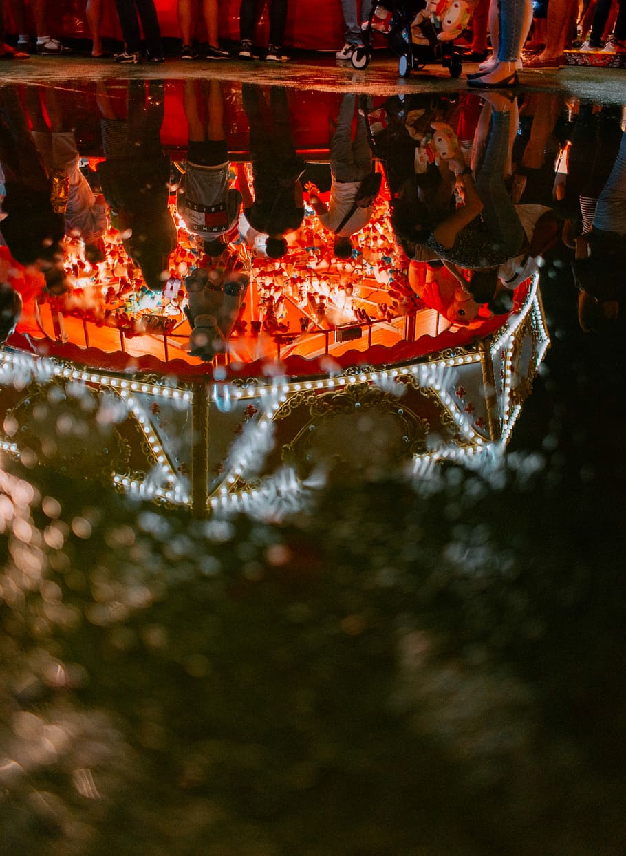 people inside carnival during nighttime, group of people standing near carousel HD wallpaper