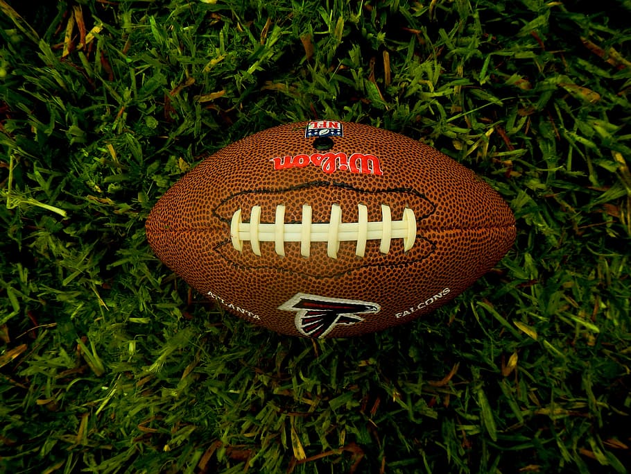 HD wallpaper: brown Atlanta Falcons football on green grass, sport, american football - Wallpaper Flare