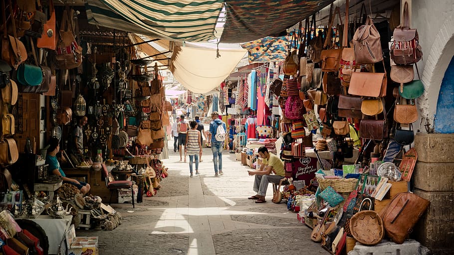 people walking in marketplace during daytime, souk, discount