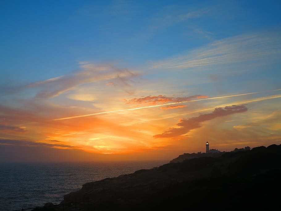 sunset, lighthouse, coast, ocean, sky, scenic, nature, coastline HD wallpaper