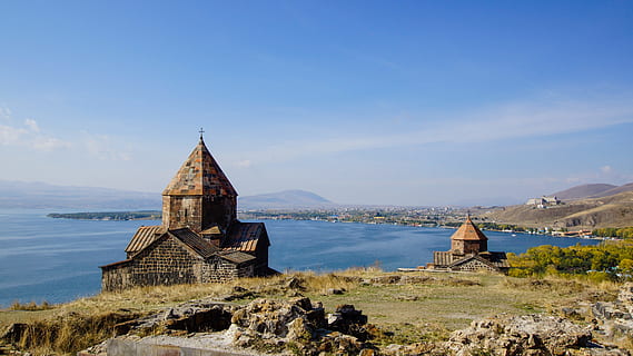 brown house near blue sea under blue clouds, Lake Sevan, Monastery HD wallpaper