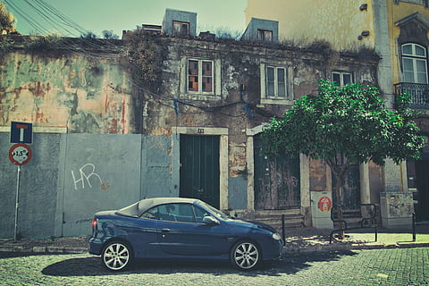 Street shot of a car sitting on an old back street in Lisbon, Portugal, image captured with a Canon DSLR HD wallpaper
