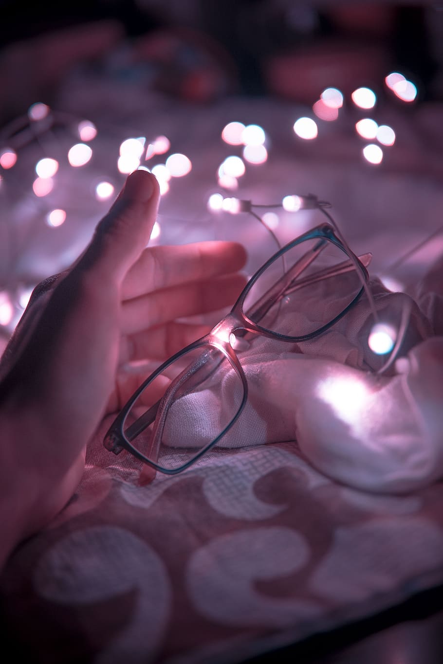 Black Frame Eyeglasses and White String Lights in White Textile HD wallpaper