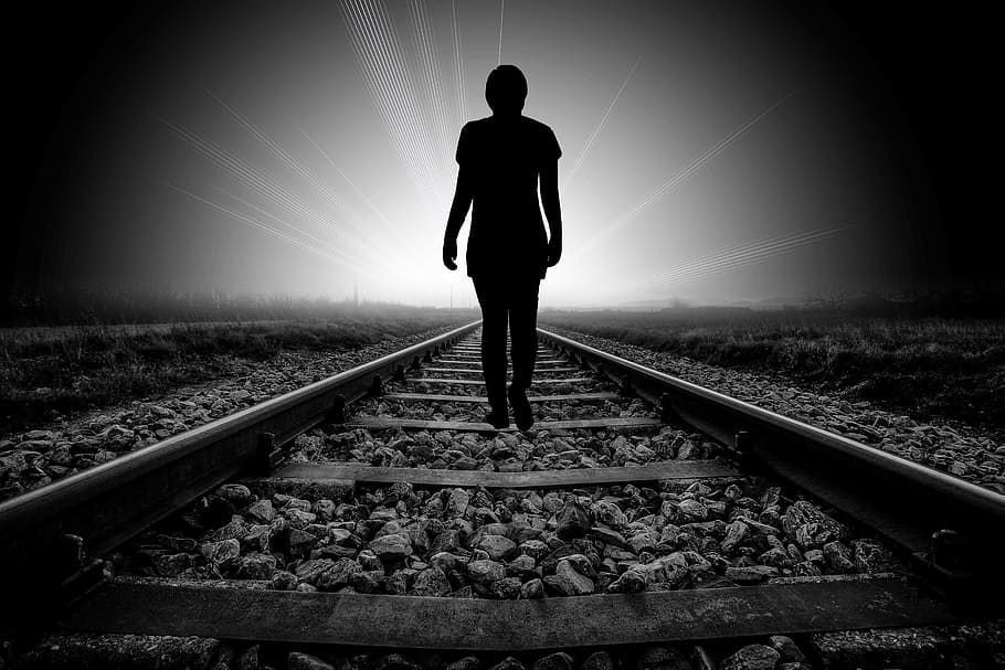 silhouette of person waling on railway, beyond, death, faith