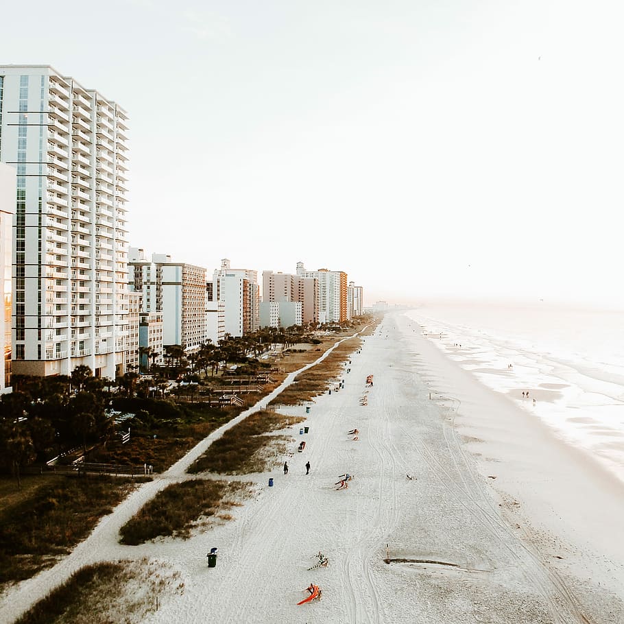 bird's-eye view of beach line, people on walking on beach, building HD wallpaper