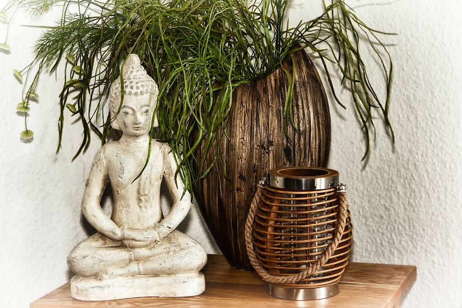 gautama Buddha figurine near brown wooden vase, religion, spiritual