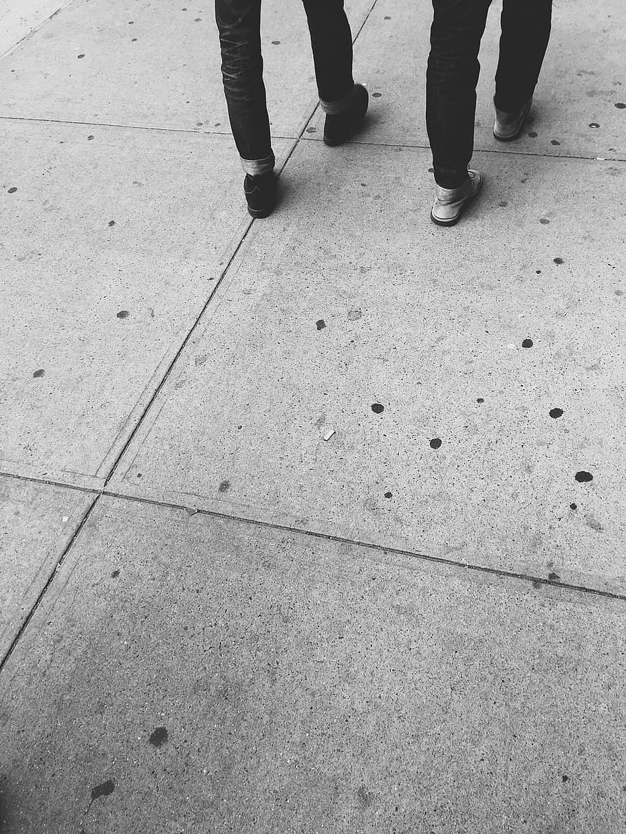 two persons walking on concrete floor, grayscale photography of two person walking HD wallpaper
