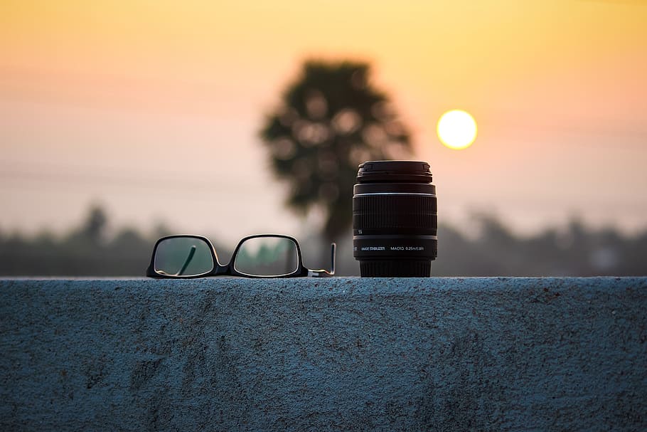 black framed eyeglasses beside camera lens, dawn, landscape HD wallpaper