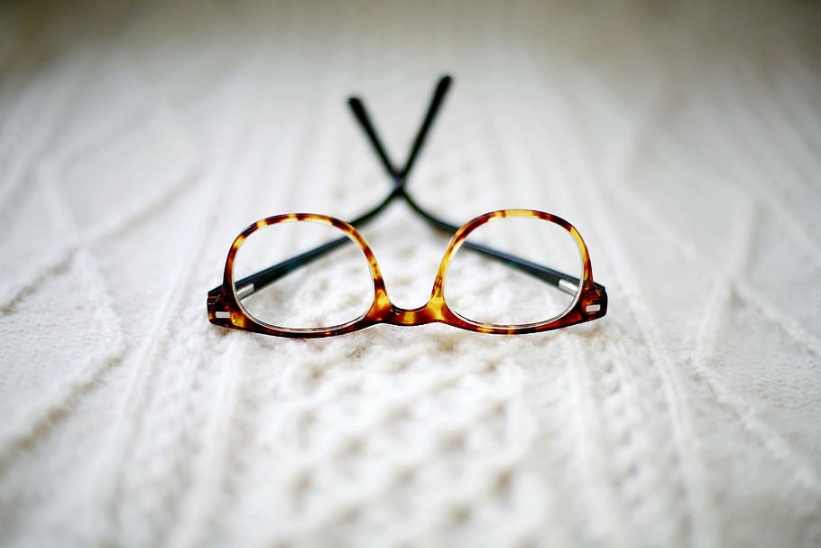 brown framed eyeglasses placed cushion, blur, bed, eyesight, eye test equipment, HD wallpaper