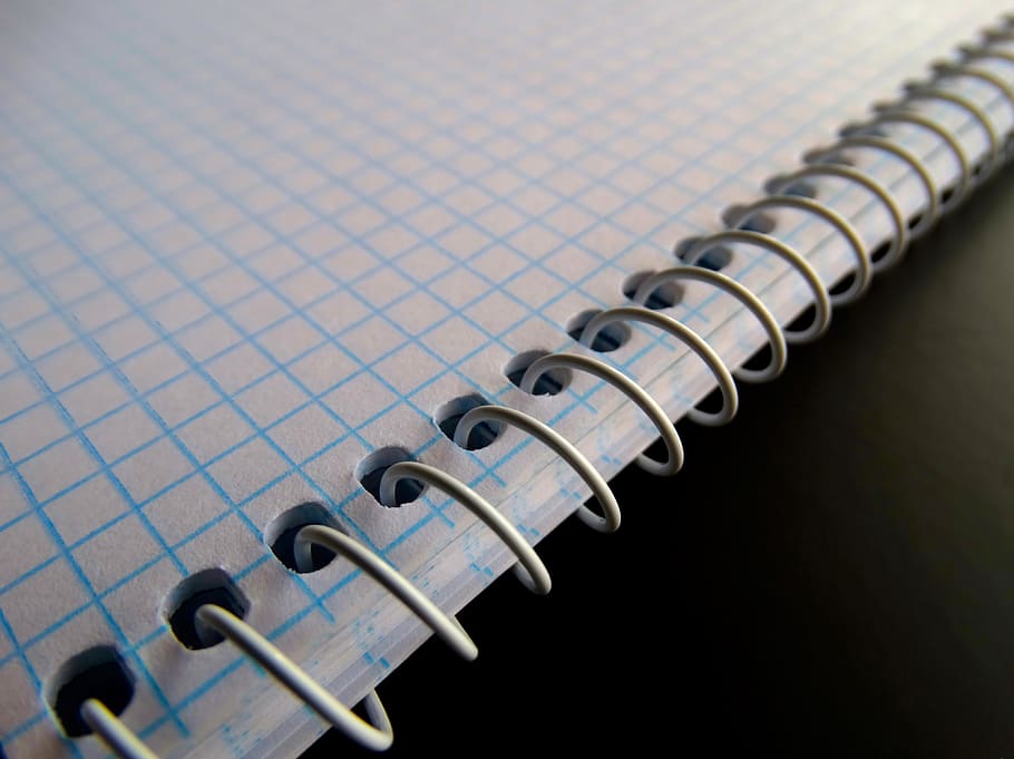 blue graphing notebook on black surface, issue, spiral notebook HD wallpaper