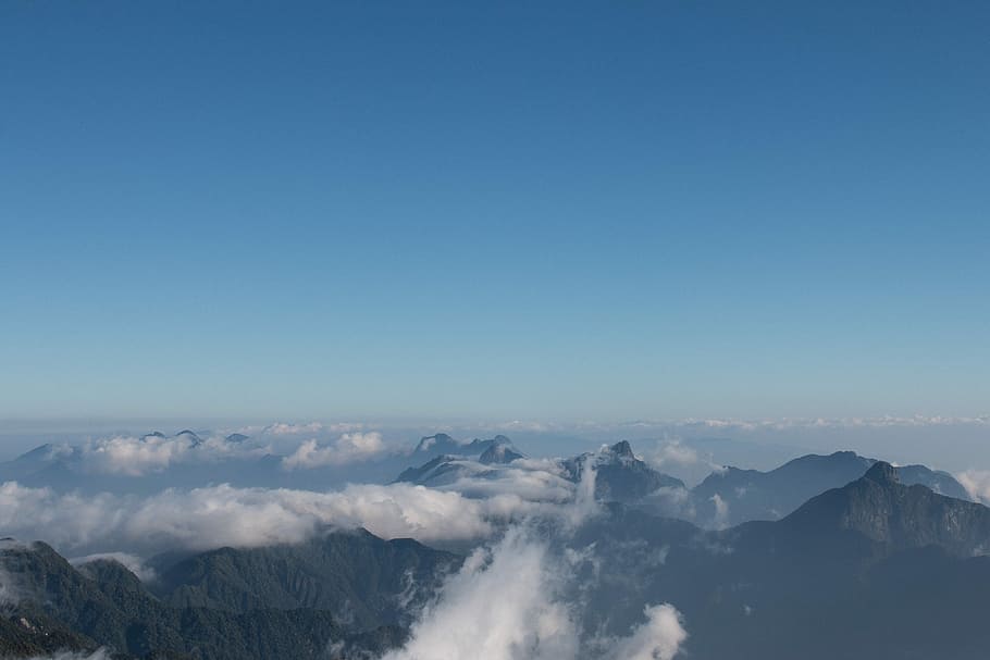 aerial photo of mountain with sea of clouds, photo of mountain covered by clouds HD wallpaper
