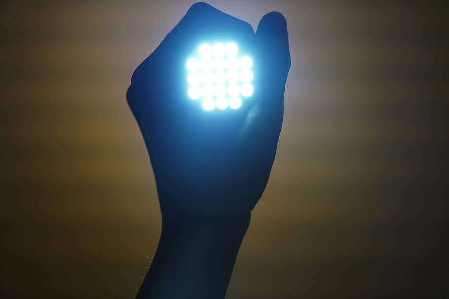 person holding LED lights, flashlight, enlightenment, lamp HD wallpaper