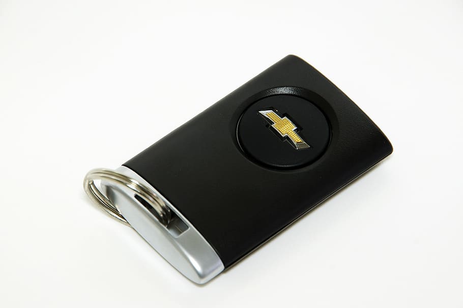 black and grey Chevrolet fob, smart key, car keys, car remote control