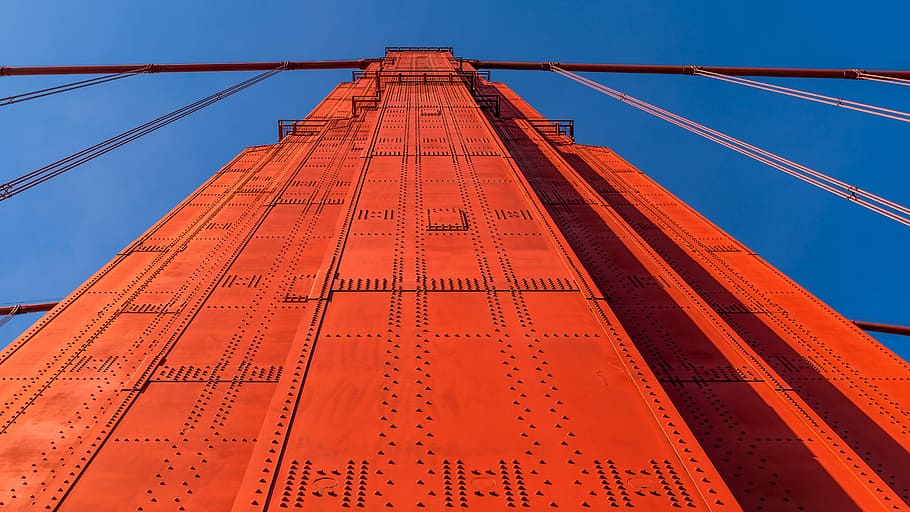 low angle photography of orange high rise building, Golden Gate Bridge support beam HD wallpaper