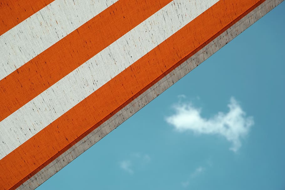 low angle photo of white and orange striped building, parasol HD wallpaper
