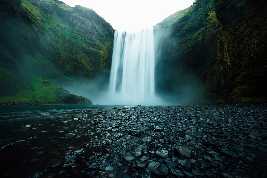 Skogafoss Falls, timelapse photograph of waterfalls rushing on to river HD wallpaper